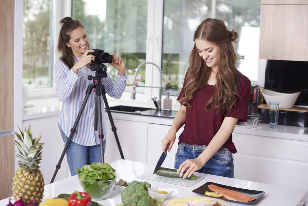 Women recording video for their food blog